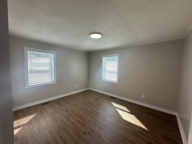 121 Pacolet, Gaffney, SC 29340 - spare room featuring crown molding, dark wood-type flooring, baseboards, and a textured ceiling