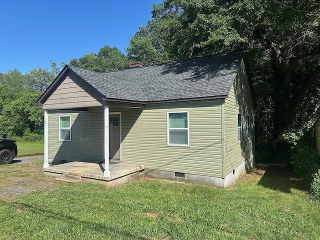121 Pacolet, Gaffney, SC 29340 - view of front of house featuring crawl space, a shingled roof, a front yard, and a chimney