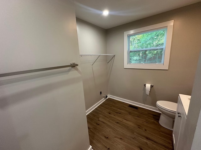 121 Pacolet, Gaffney, SC 29340 - bathroom with toilet, vanity, wood finished floors, baseboards, and a walk in closet