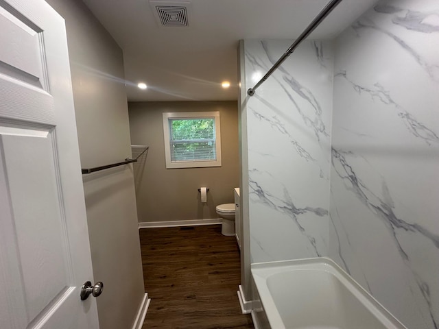 121 Pacolet, Gaffney, SC 29340 - bathroom featuring wood finished floors, toilet, baseboards, washtub / shower combination, and recessed lighting