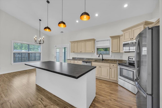 624 Renita, Boiling Springs, SC 29316 - kitchen with stainless steel appliances, cream cabinets, a sink, dark countertops, and lofted ceiling