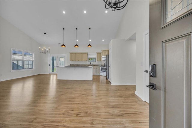 624 Renita, Boiling Springs, SC 29316 - kitchen with a chandelier, open floor plan, high vaulted ceiling, light wood-style flooring, and stainless steel appliances