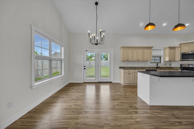 624 Renita, Boiling Springs, SC 29316 - kitchen with stainless steel appliances, cream cabinetry, a chandelier, plenty of natural light, and a high ceiling