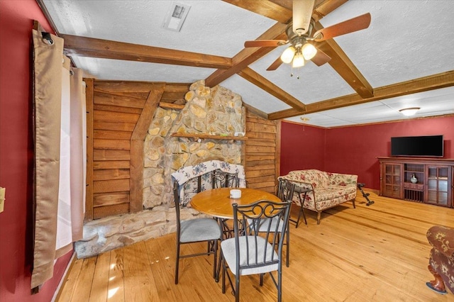 775 Buck Crk, Chesnee, SC 29323 - dining space featuring beamed ceiling, hardwood / wood-style floors, ceiling fan, and a textured ceiling