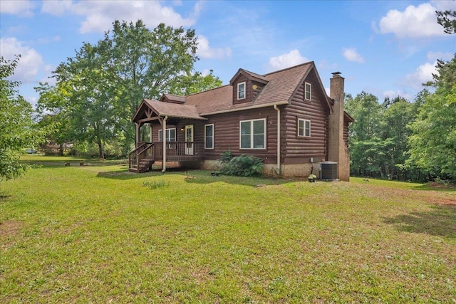 775 Buck Crk, Chesnee, SC 29323 - log cabin featuring a chimney, central AC unit, a front yard, and log siding
