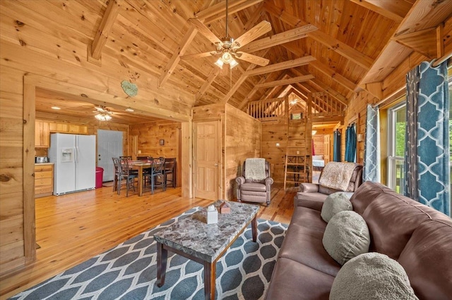 775 Buck Crk, Chesnee, SC 29323 - living area featuring wood walls, wooden ceiling with exposed beams, a ceiling fan, light wood-style floors, and high vaulted ceiling