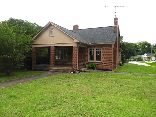 823 W Smith St, Gaffney, SC 29341 - view of front of house with brick siding, a front yard, a chimney, roof with shingles, and covered porch