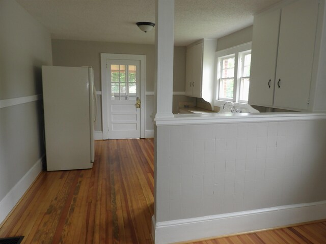 823 W Smith St, Gaffney, SC 29341 - kitchen with freestanding refrigerator, plenty of natural light, baseboards, and light countertops