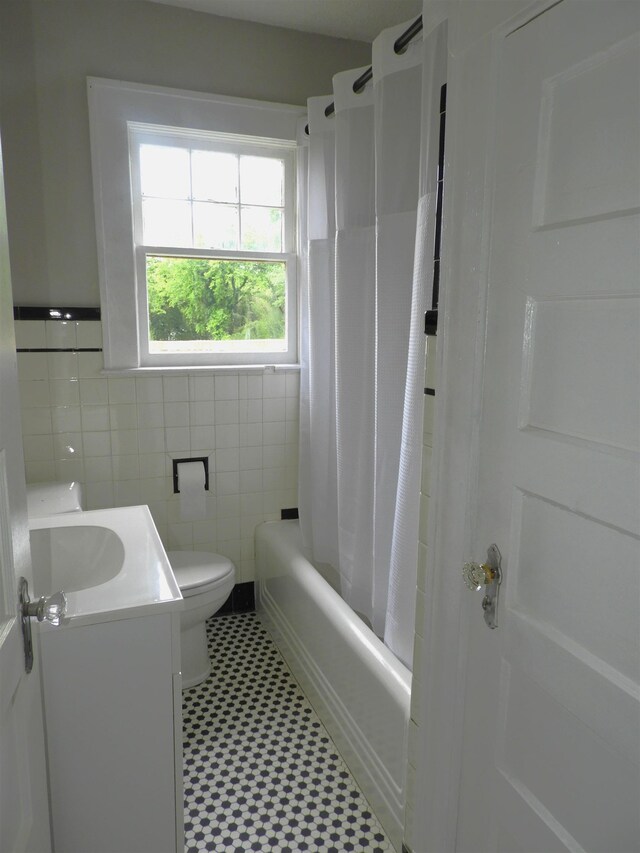823 W Smith St, Gaffney, SC 29341 - full bath with vanity, shower / bath combo, tile patterned floors, toilet, and tile walls