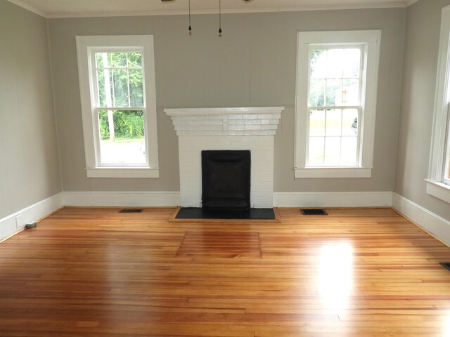 823 W Smith St, Gaffney, SC 29341 - unfurnished living room featuring ornamental molding, wood finished floors, baseboards, and a fireplace