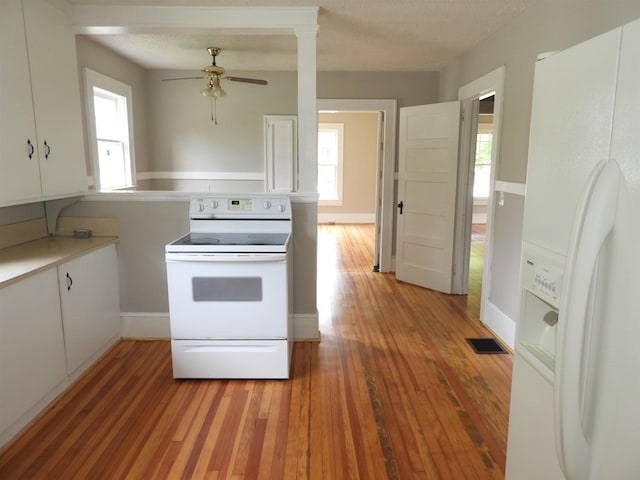 823 W Smith St, Gaffney, SC 29341 - kitchen with white appliances, light wood-style floors, ceiling fan, light countertops, and white cabinetry