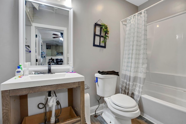 1050 W Blackstock, Spartanburg, SC 29301 - full bath with shower / tub combo, toilet, vanity, wood finished floors, and a ceiling fan
