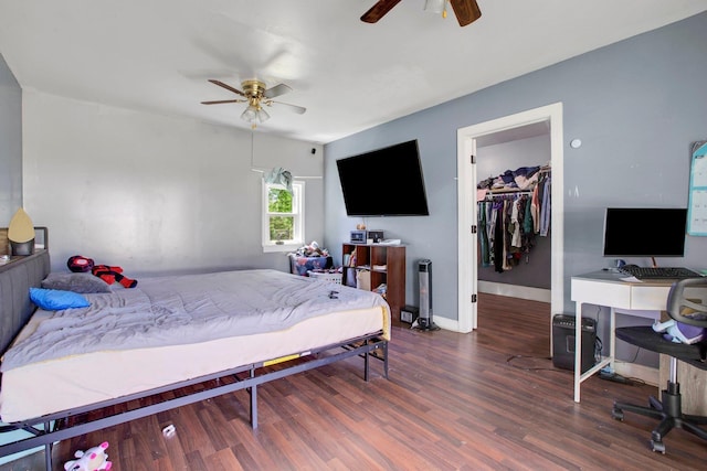 1050 W Blackstock, Spartanburg, SC 29301 - bedroom with wood finished floors, a walk in closet, an office area, baseboards, and a ceiling fan