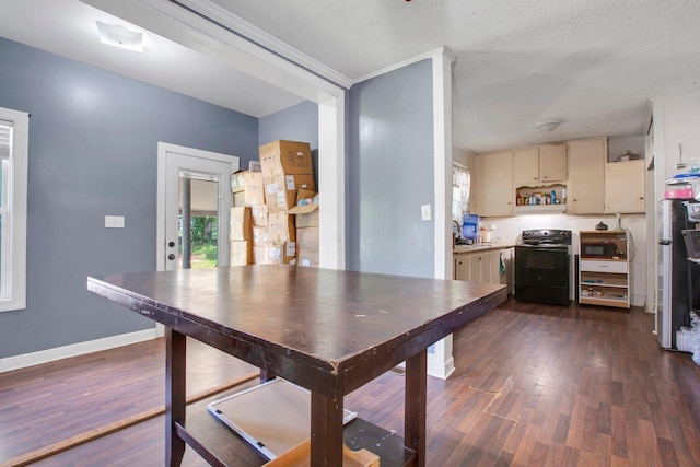 1050 W Blackstock, Spartanburg, SC 29301 - dining space with dark wood-type flooring, baseboards, and a textured ceiling