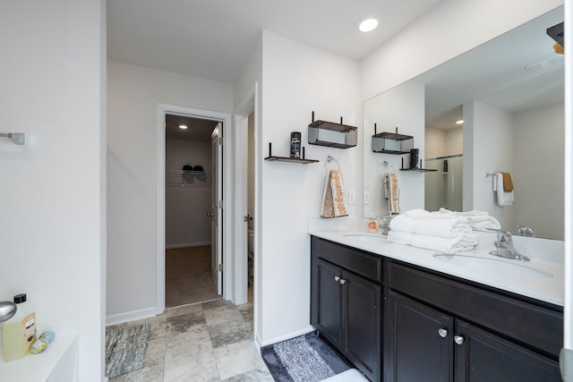 912 Brynderwen, Lyman, SC 29365 - full bathroom featuring double vanity, a spacious closet, an enclosed shower, and baseboards