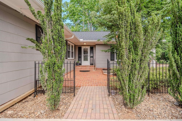 236 S Park, Spartanburg, SC 29302 - view of exterior entry featuring a gate and roof with shingles