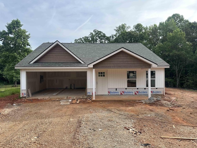 148 Kristin, Gaffney, SC 29341 - property under construction with covered porch, a garage, dirt driveway, and a shingled roof