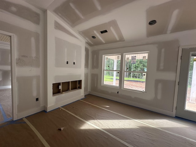 148 Kristin, Gaffney, SC 29341 - unfurnished living room featuring plenty of natural light, a glass covered fireplace, and baseboards