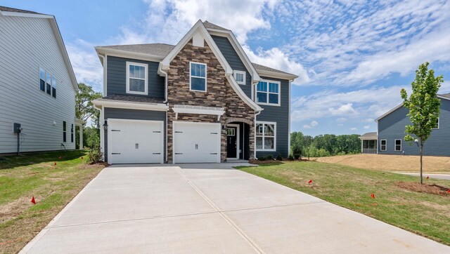 315 Fiery, Mauldin, SC 29607 - craftsman-style house with stone siding, concrete driveway, an attached garage, a front lawn, and roof with shingles