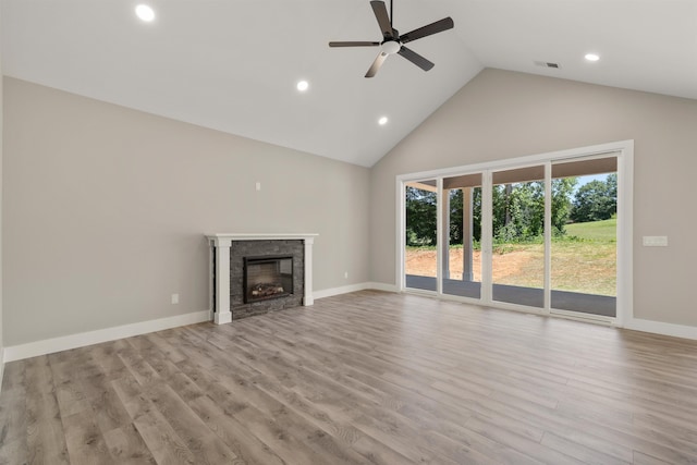 3135 E Croft, Spartanburg, SC 29302 - unfurnished living room featuring high vaulted ceiling, a ceiling fan, recessed lighting, a stone fireplace, and wood finished floors