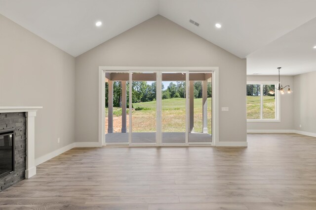 3135 E Croft, Spartanburg, SC 29302 - unfurnished living room featuring a stone fireplace, a chandelier, recessed lighting, light wood finished floors, and high vaulted ceiling
