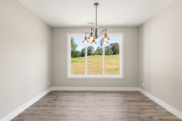 3135 E Croft, Spartanburg, SC 29302 - unfurnished dining area with a chandelier, wood finished floors, and baseboards