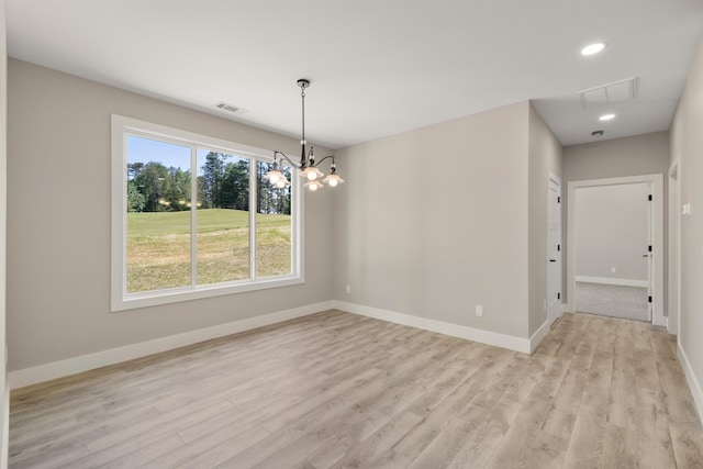 3135 E Croft, Spartanburg, SC 29302 - spare room featuring light wood-style flooring, baseboards, recessed lighting, a chandelier, and attic access