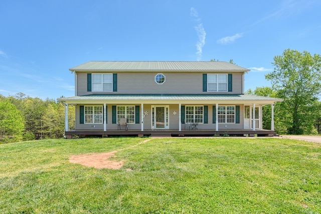 955 Baggett Rd, Enoree, SC 29335 - view of front of house featuring metal roof, covered porch, and a front lawn