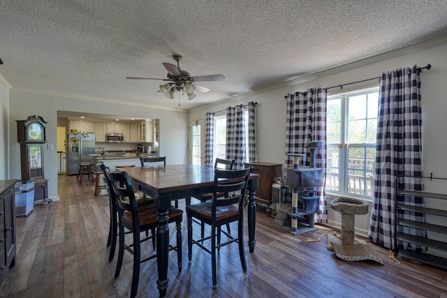 955 Baggett Rd, Enoree, SC 29335 - dining area featuring ornamental molding, dark wood-style floors, healthy amount of natural light, a ceiling fan, and a textured ceiling