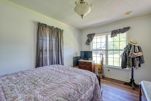 955 Baggett Rd, Enoree, SC 29335 - bedroom with hardwood / wood-style floors, a textured ceiling, ornamental molding, and baseboards