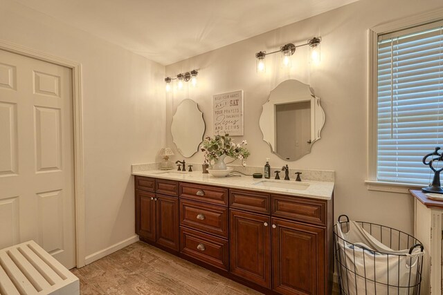 955 Baggett Rd, Enoree, SC 29335 - bathroom featuring double vanity and wood finished floors