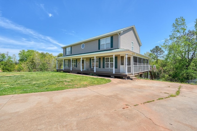 955 Baggett Rd, Enoree, SC 29335 - farmhouse inspired home with covered porch, concrete driveway, and a front lawn