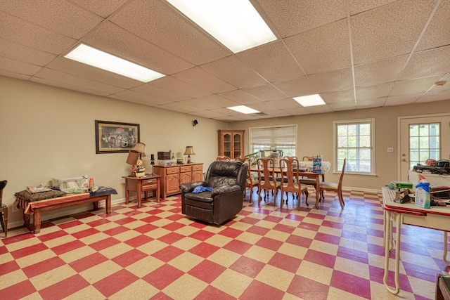 955 Baggett Rd, Enoree, SC 29335 - living room featuring a paneled ceiling, light flooring, and baseboards