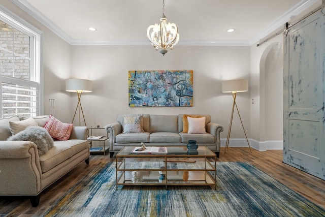 127 Turnberry, Spartanburg, SC 29306 - living room with wood finished floors, arched walkways, a chandelier, baseboards, and ornamental molding