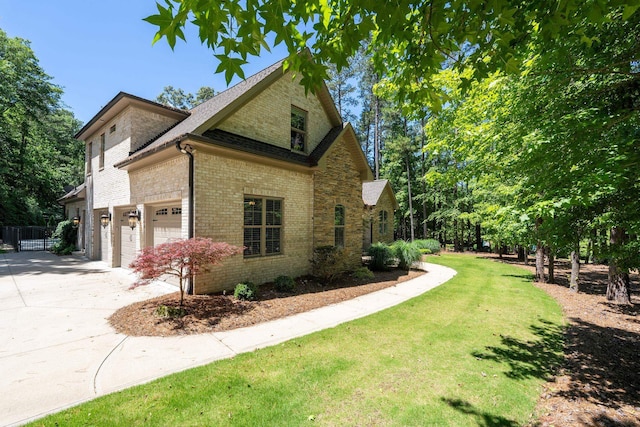 127 Turnberry, Spartanburg, SC 29306 - view of side of property featuring concrete driveway, brick siding, and roof with shingles