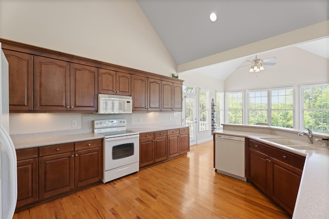 404 N Tidewater, Inman, SC 29349 - kitchen featuring white appliances, light wood-style floors, light countertops, and high vaulted ceiling