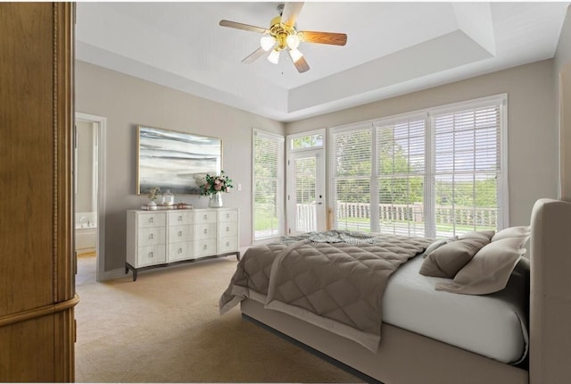 404 N Tidewater, Inman, SC 29349 - carpeted bedroom with access to outside, ceiling fan, connected bathroom, and a tray ceiling