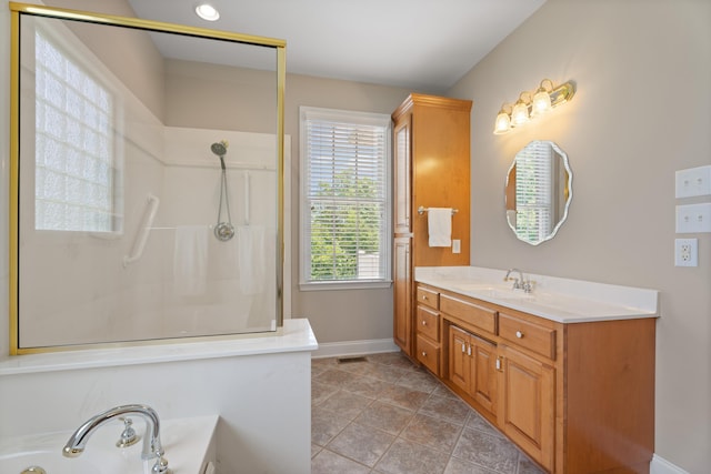 404 N Tidewater, Inman, SC 29349 - full bath with vanity, a garden tub, baseboards, a shower, and tile patterned flooring
