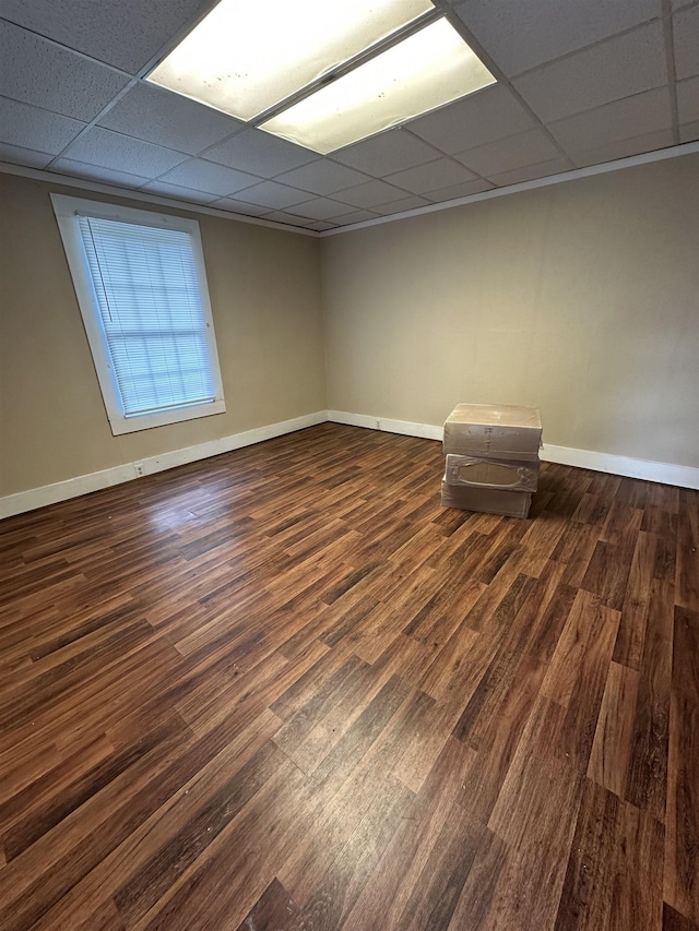 401 Elm, Gaffney, SC 29340 - spare room featuring a drop ceiling, dark wood-type flooring, and baseboards