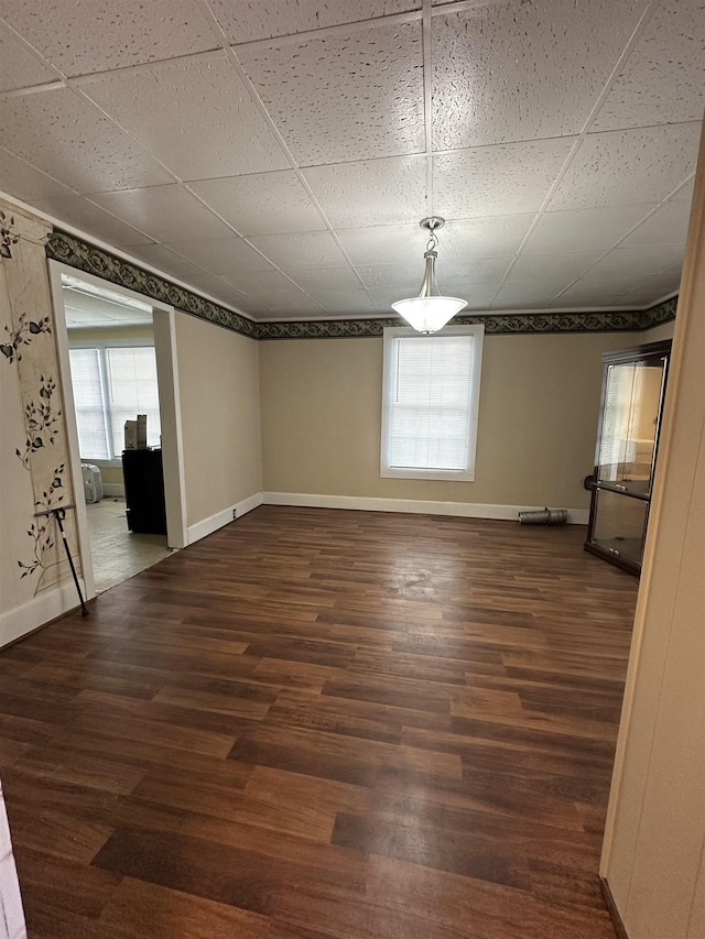 401 Elm, Gaffney, SC 29340 - unfurnished room with baseboards and dark wood-type flooring