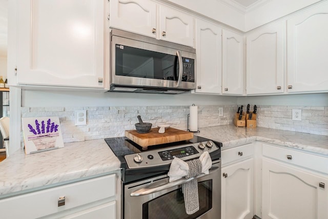 204 Thornhill, Spartanburg, SC 29301 - kitchen with stainless steel appliances, white cabinetry, tasteful backsplash, and crown molding