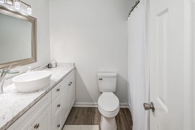204 Thornhill, Spartanburg, SC 29301 - bathroom featuring vanity, wood finished floors, toilet, and baseboards