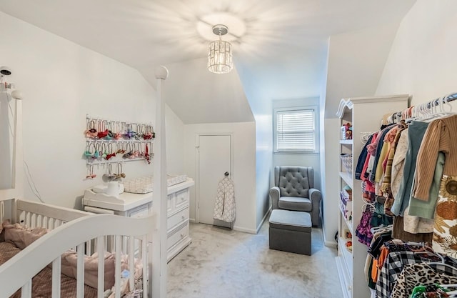 204 Thornhill, Spartanburg, SC 29301 - bedroom featuring light colored carpet, lofted ceiling, a chandelier, and a crib