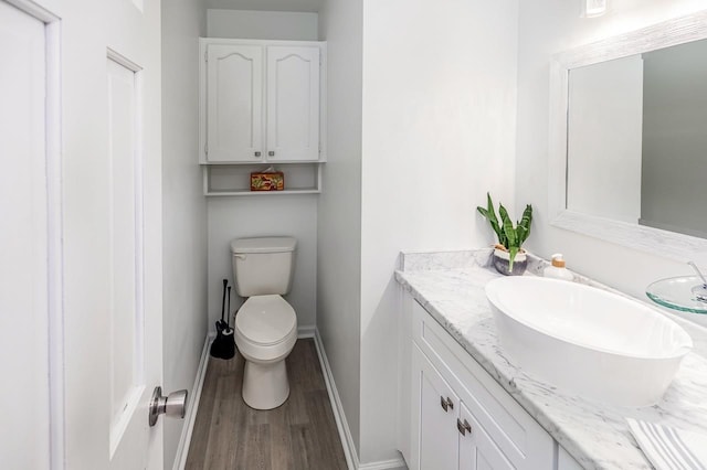 204 Thornhill, Spartanburg, SC 29301 - half bath with vanity, wood finished floors, toilet, and baseboards