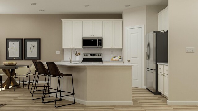 1612 Wren Crk, Boiling Springs, SC 29316 - kitchen featuring appliances with stainless steel finishes, backsplash, light wood finished floors, and light countertops