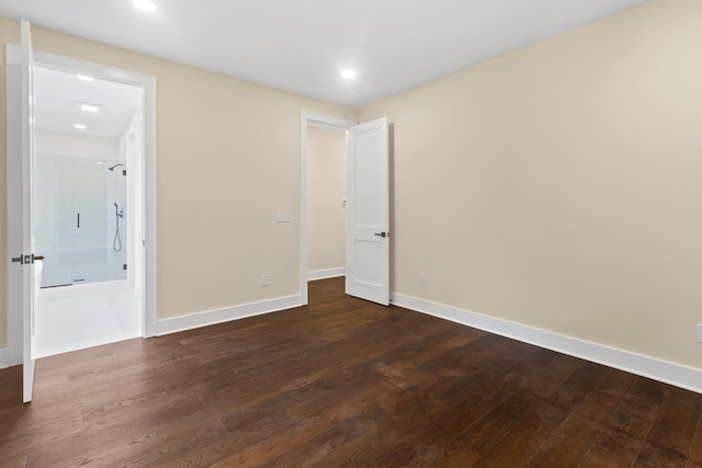 130 Market Bay, Simpsonville, SC 29681 - unfurnished bedroom featuring dark wood-type flooring, baseboards, recessed lighting, and connected bathroom