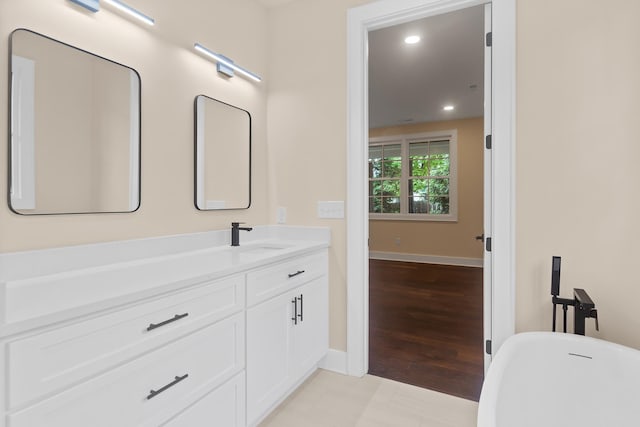 130 Market Bay, Simpsonville, SC 29681 - bathroom with a freestanding tub, vanity, baseboards, and recessed lighting