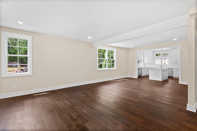 130 Market Bay, Simpsonville, SC 29681 - unfurnished living room featuring dark wood-type flooring, baseboards, and recessed lighting