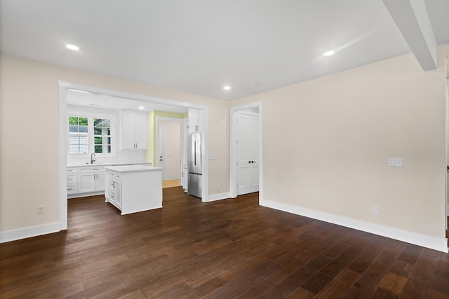 130 Market Bay, Simpsonville, SC 29681 - unfurnished living room featuring dark wood finished floors, baseboards, a sink, and recessed lighting