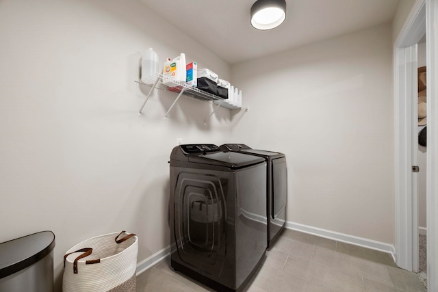 813 Elgon Walk, Fountain Inn, SC 29644 - laundry room featuring washer and dryer, baseboards, and light tile patterned floors